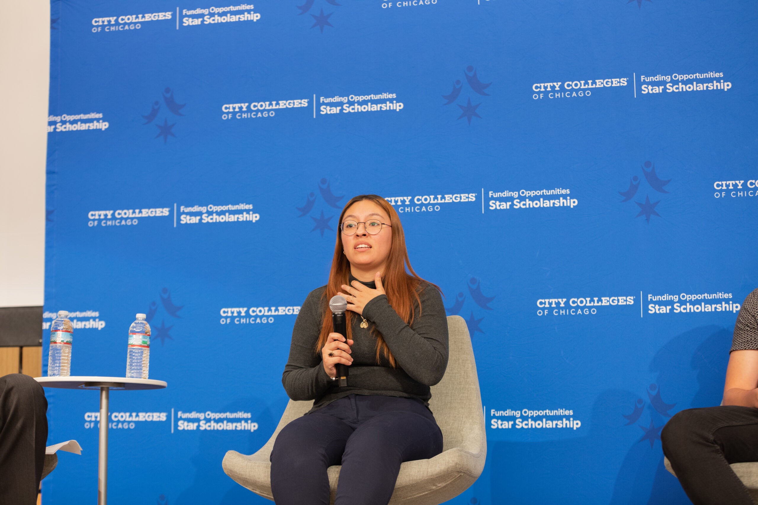 Malcolm X College student Karen Sinchi-Sarmiento speaks on the panel.